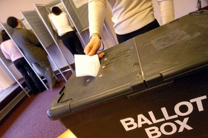 Vote being put into a ballot box