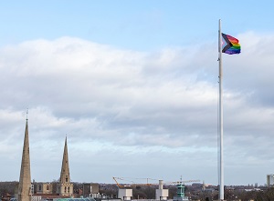 LGBTQ+ flag flying above Cambridge