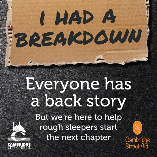 Cardboard sign reads "I had a breakdown". Poster states 'Everyone has a back story, but we're here to help rough sleepers start the next chapter