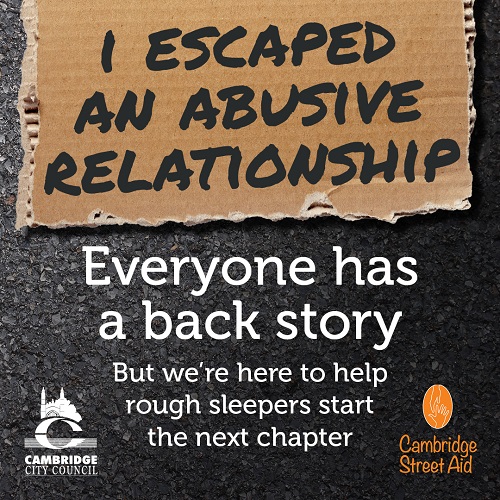 Cardboard sign reads "I escaped an abusive relationship". Poster states 'Everyone has a back story, but we're here to help rough sleepers start the next chapter