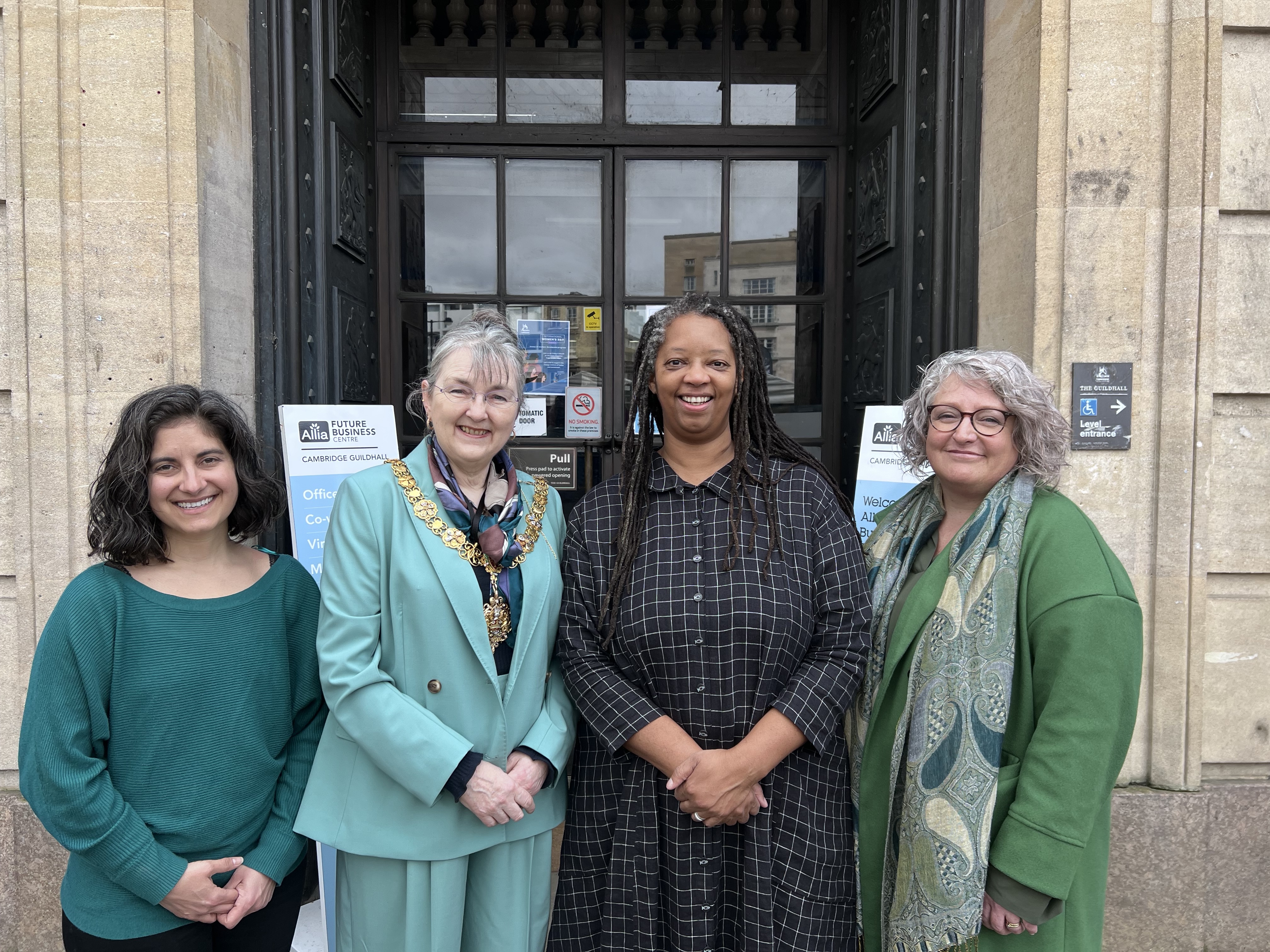 Four women standing in front of the Guildhall