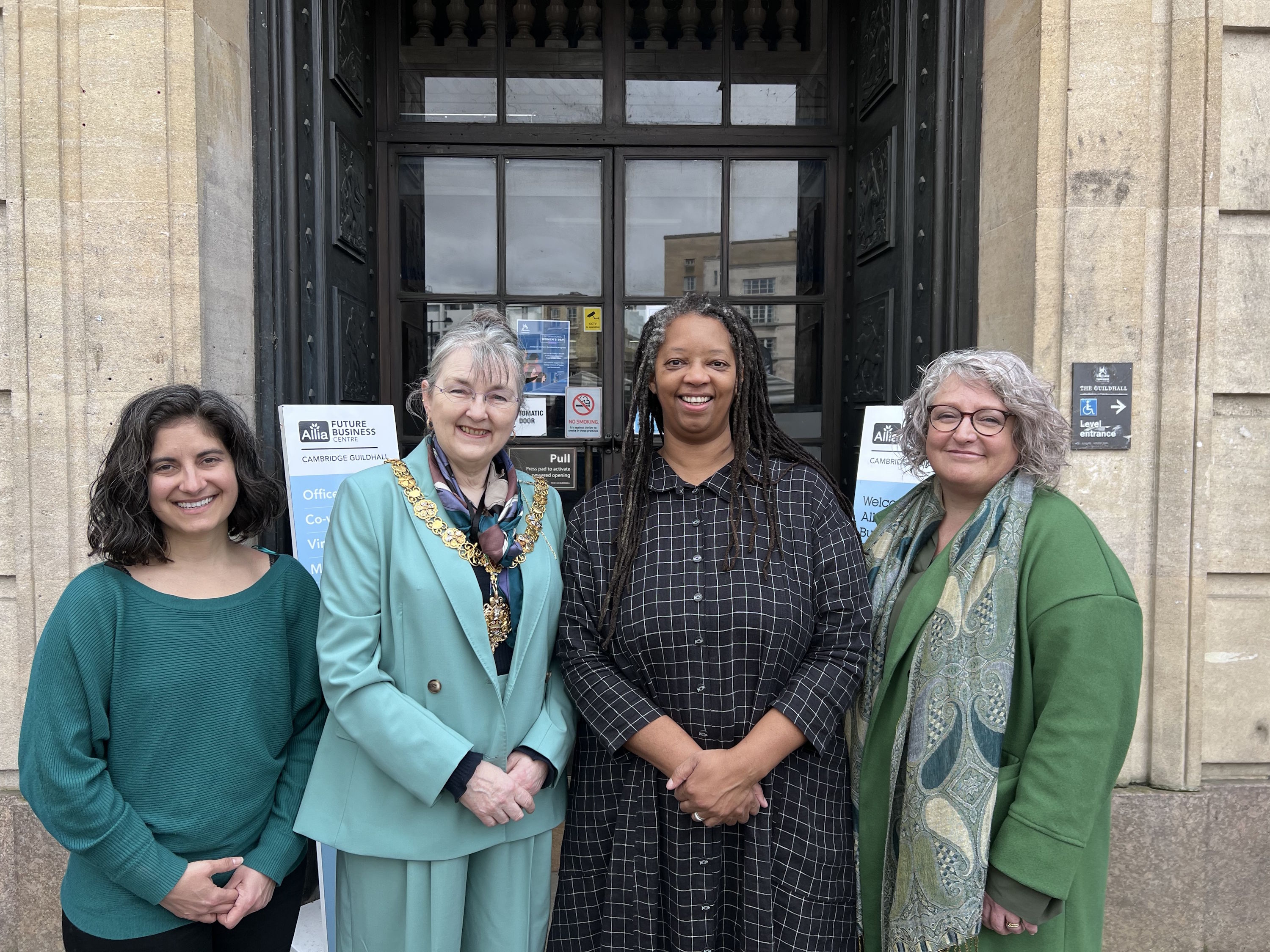 Four women standing in front of the Guildhall