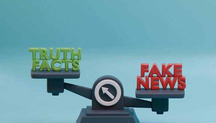 A weighing scale with truth facts on the left and fake news on the right