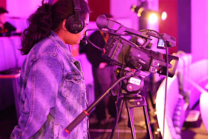 Young person using a video camera